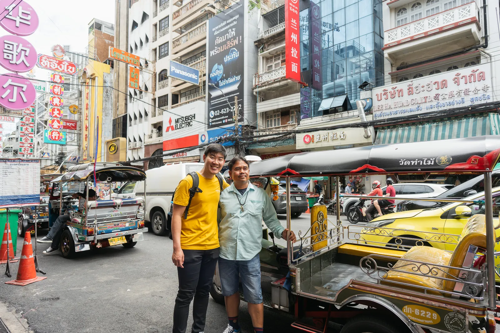 Taxis and traffic along bustling Chinatown